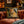 Load image into Gallery viewer, Decorative pillow with a tiger design on a brown sofa in a cozy room.
